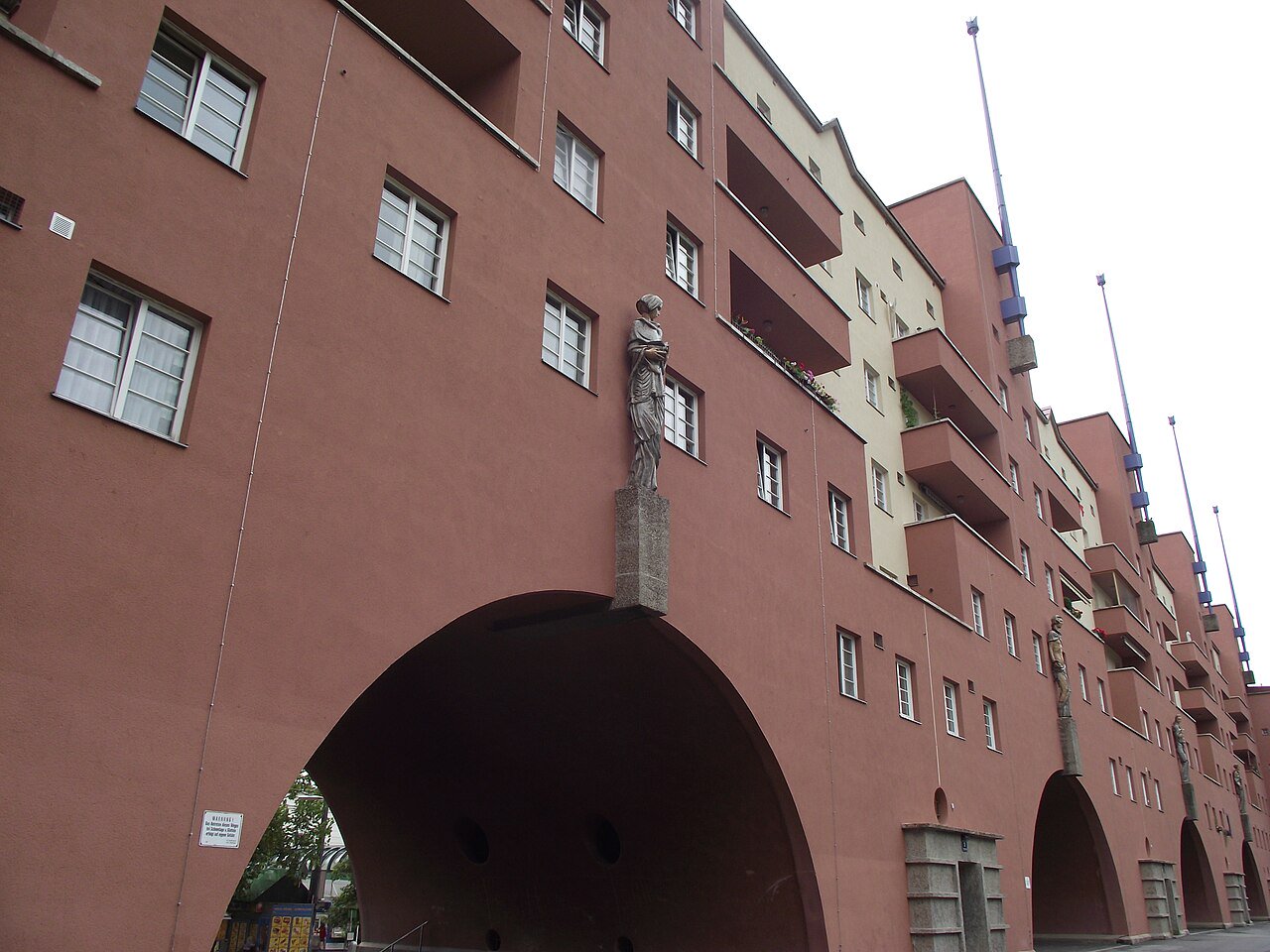 The Karl-Marx-Hof social housing complex in Vienna, a red-brick building with large arches, built as part of Vienna's public housing programme.